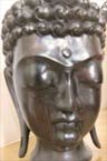A wooden statue of Buddha's head