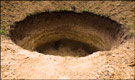 The hole in the cavern floor