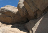 Shade from the overhanging rocks