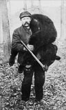 Old photo of hunter and black bear