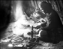 Old photo of a Navajo silversmith at work