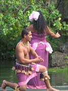 Polynesian dancers on a canoe